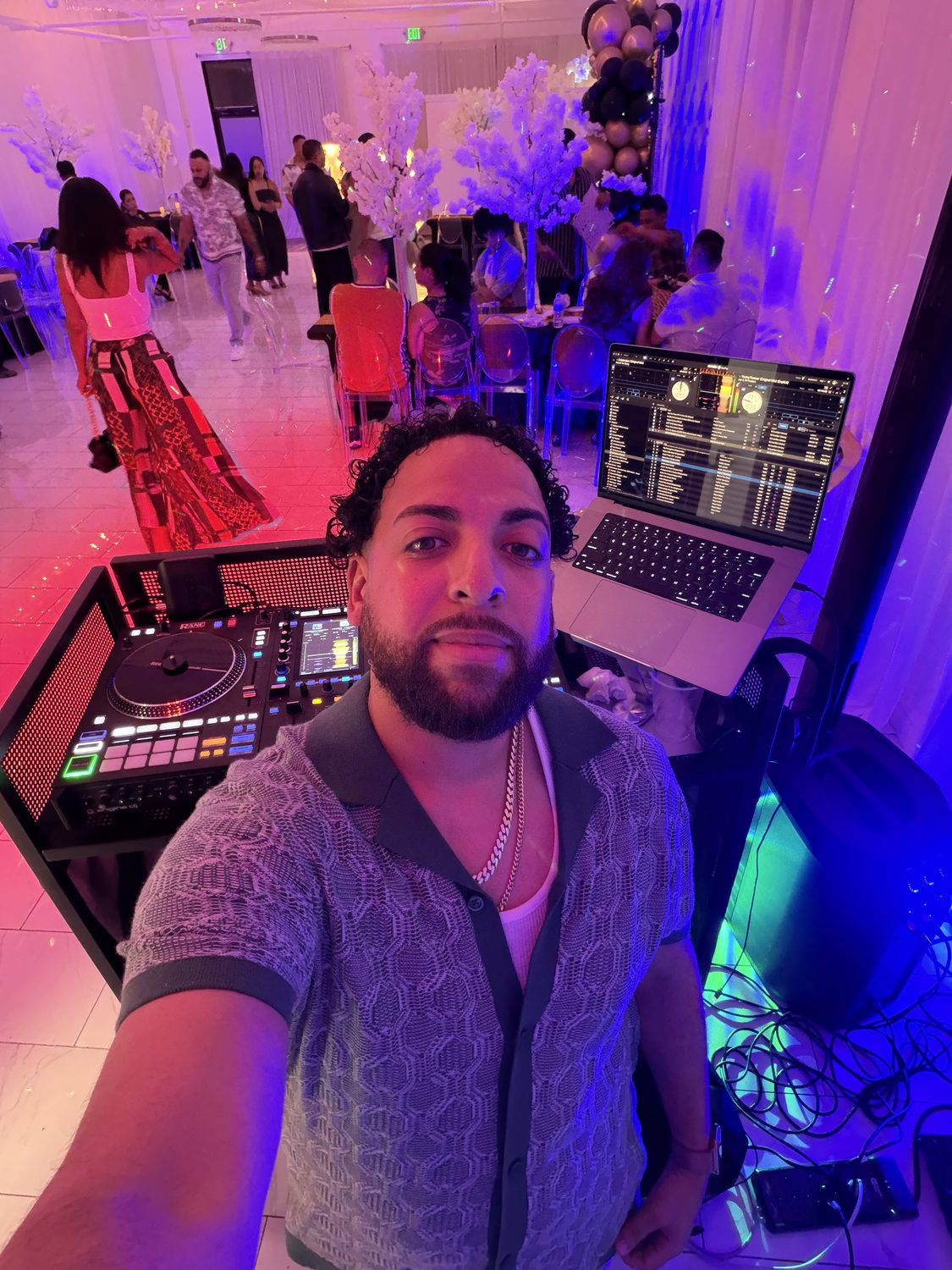 DJ LevSev at a birthday party with colorful lighting