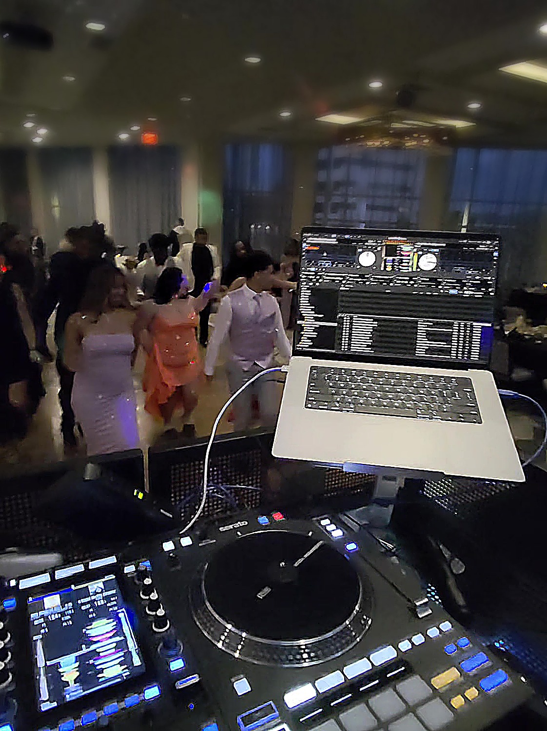 Prom crowd dancing from behind the decks